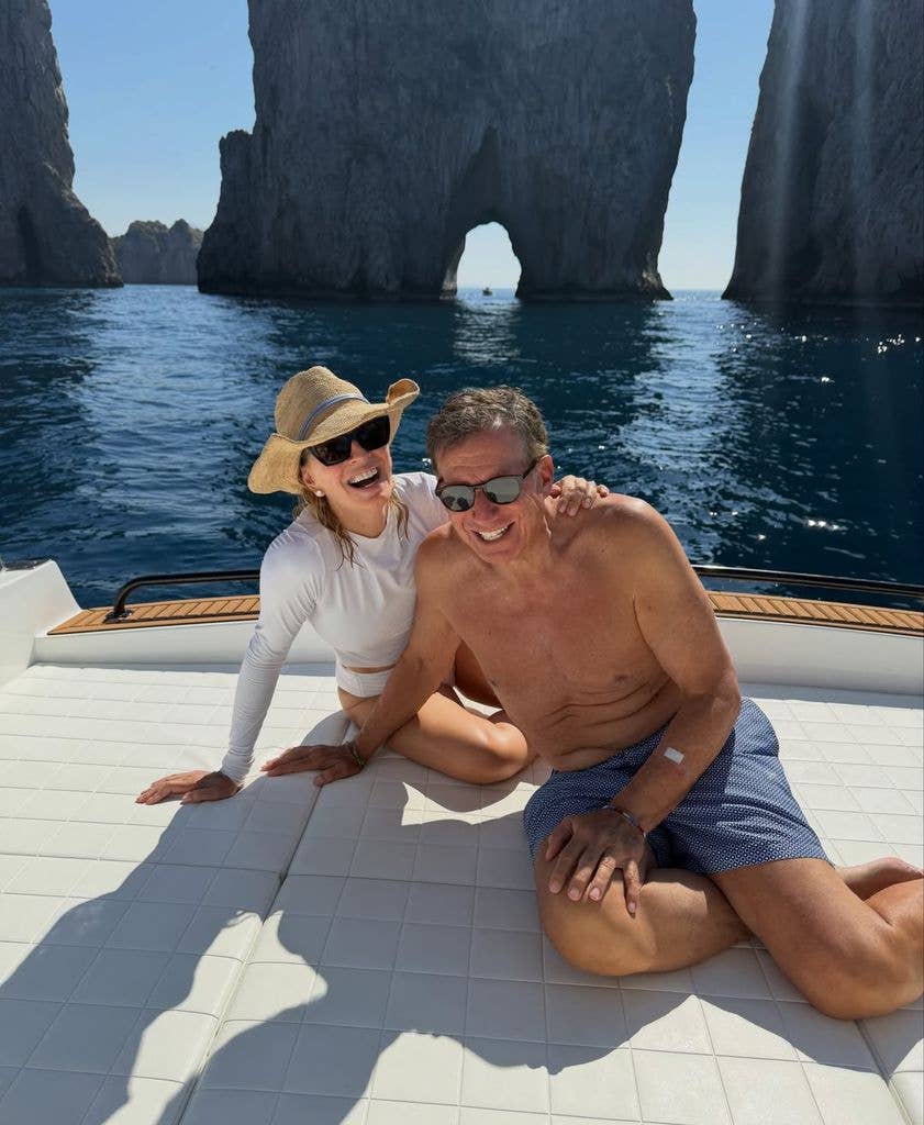 photo of Dr. Jennifer Ashton and husband, Tom Werner laughing on deck of boat