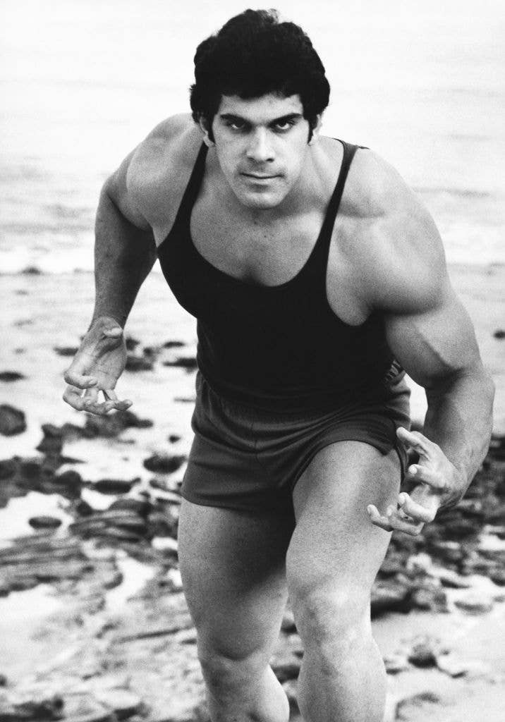 Lou dressed in a singlet, as he poses on a beach, Malibu, California, 1978