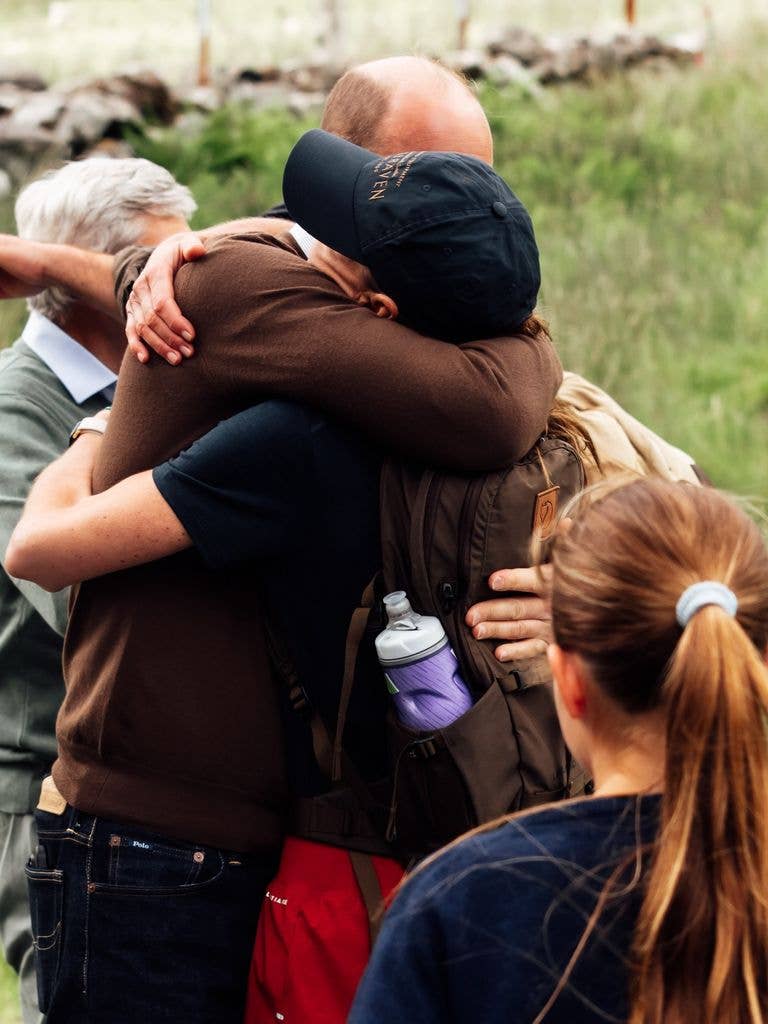 Prince William wrapping his arms around Kate in a heartfelt hug after she completed the demanding challenge