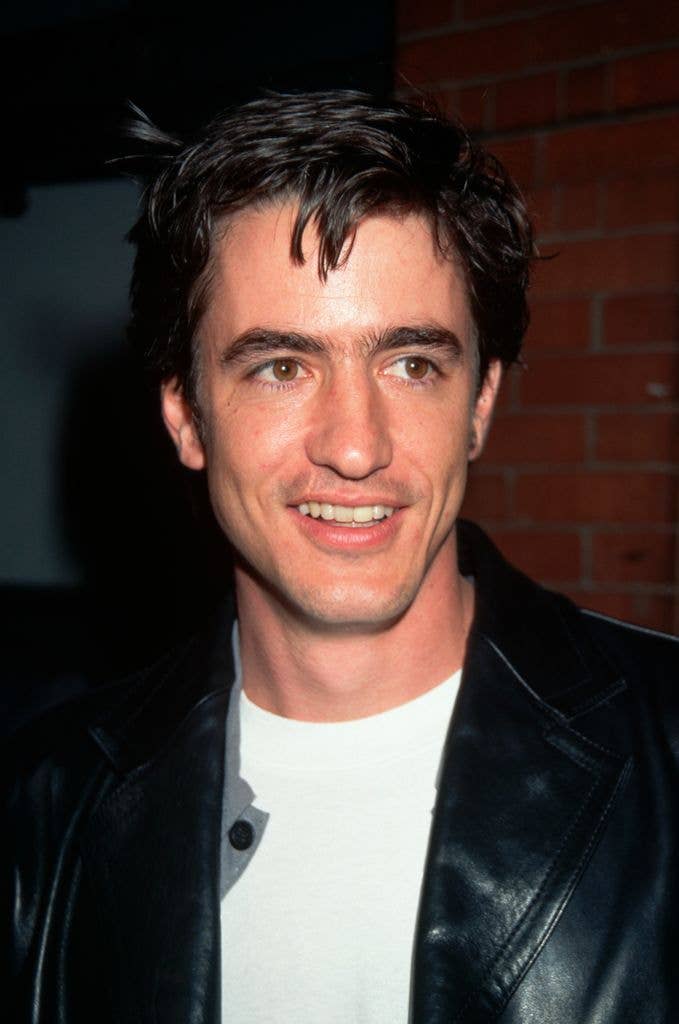 Dermot Mulroney, at the premiere of the movie, "The Pallbearer." He is wearing a white t shirt and a black, leather jacket.   