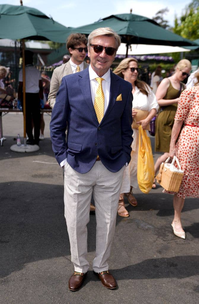 Sir Christopher Dean wearing a suit