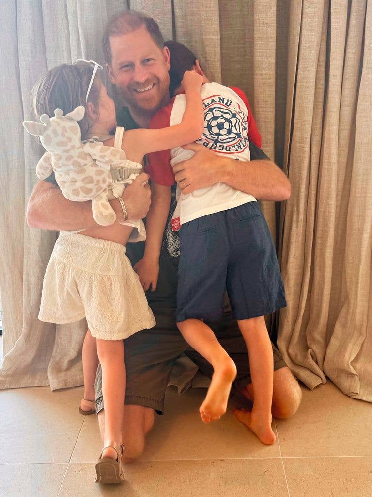 Prince Harry hugs Prince Archie and Princess Lilibet at home in California
