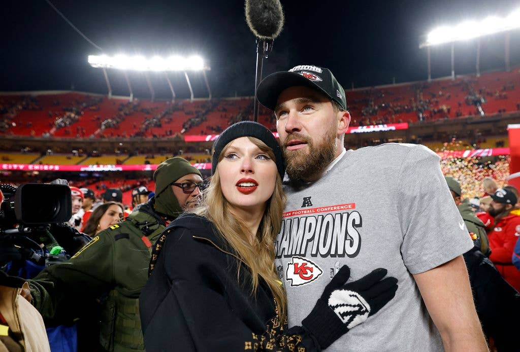 Taylor Swift celebrates with Travis Kelce #87 of the Kansas City Chiefs after defeating the Buffalo Bills 32-29 in the AFC Championship Game at GEHA Field at Arrowhead Stadium on January 26, 2025 in Kansas City, Missouri.  (Photo by David Eulitt/Getty Images)