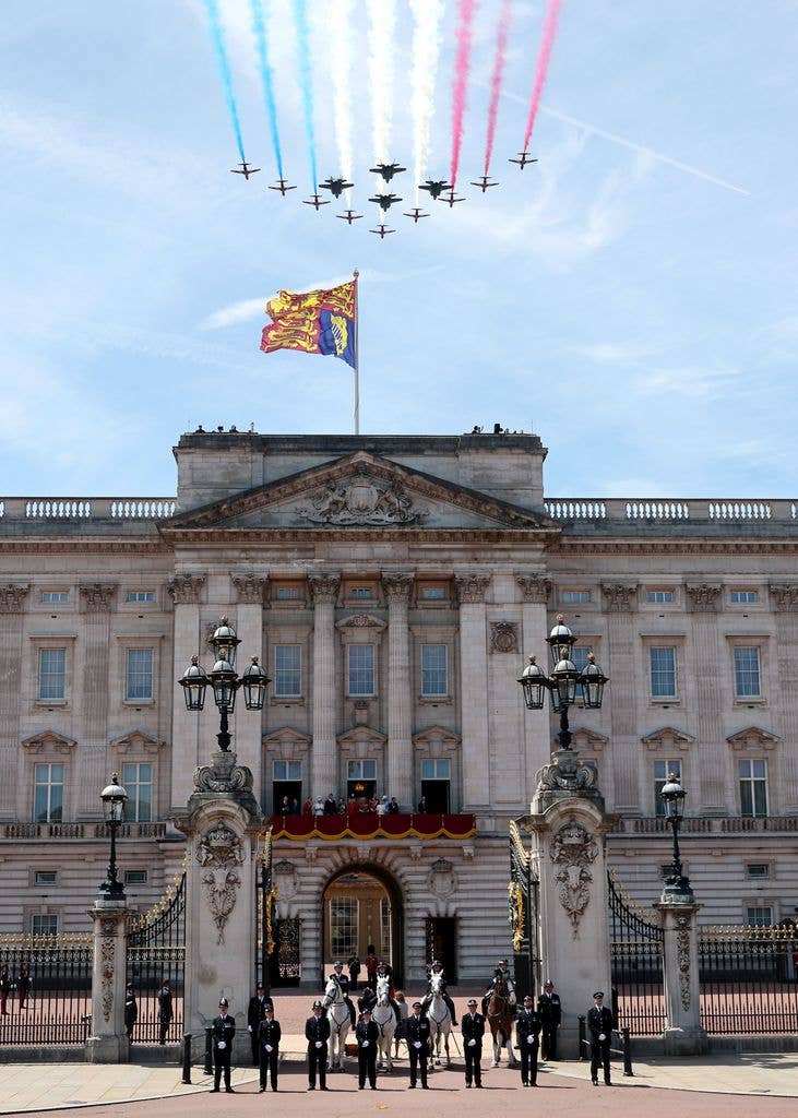 The Red Arrows, officially known as the Royal Air Force Aerobatic Team, perform a flypast over Buckingham Palace