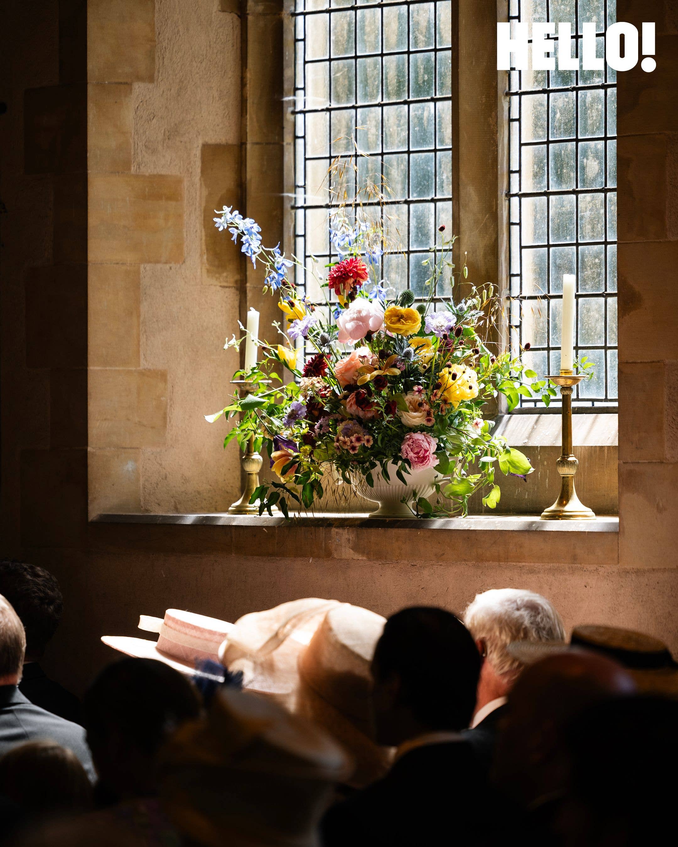 June sunshine spills through the window onto a floral display