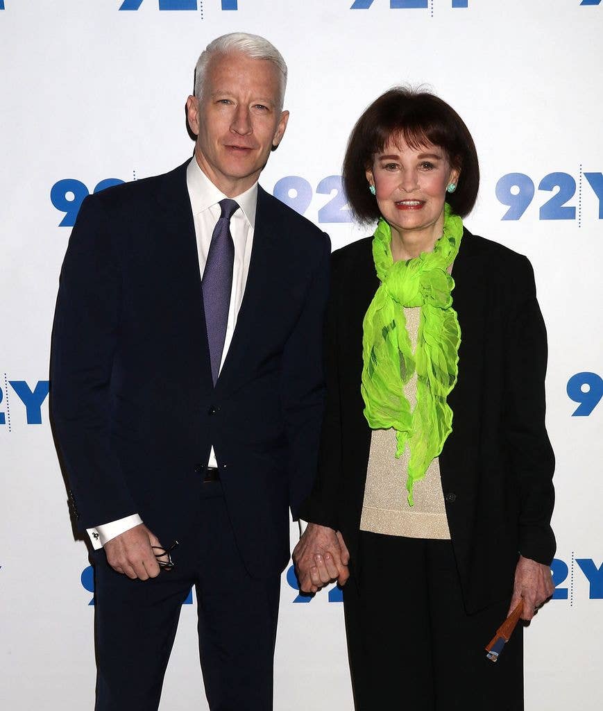 Anderson Cooper and Gloria Vanderbilt standing together, smiling, at an event