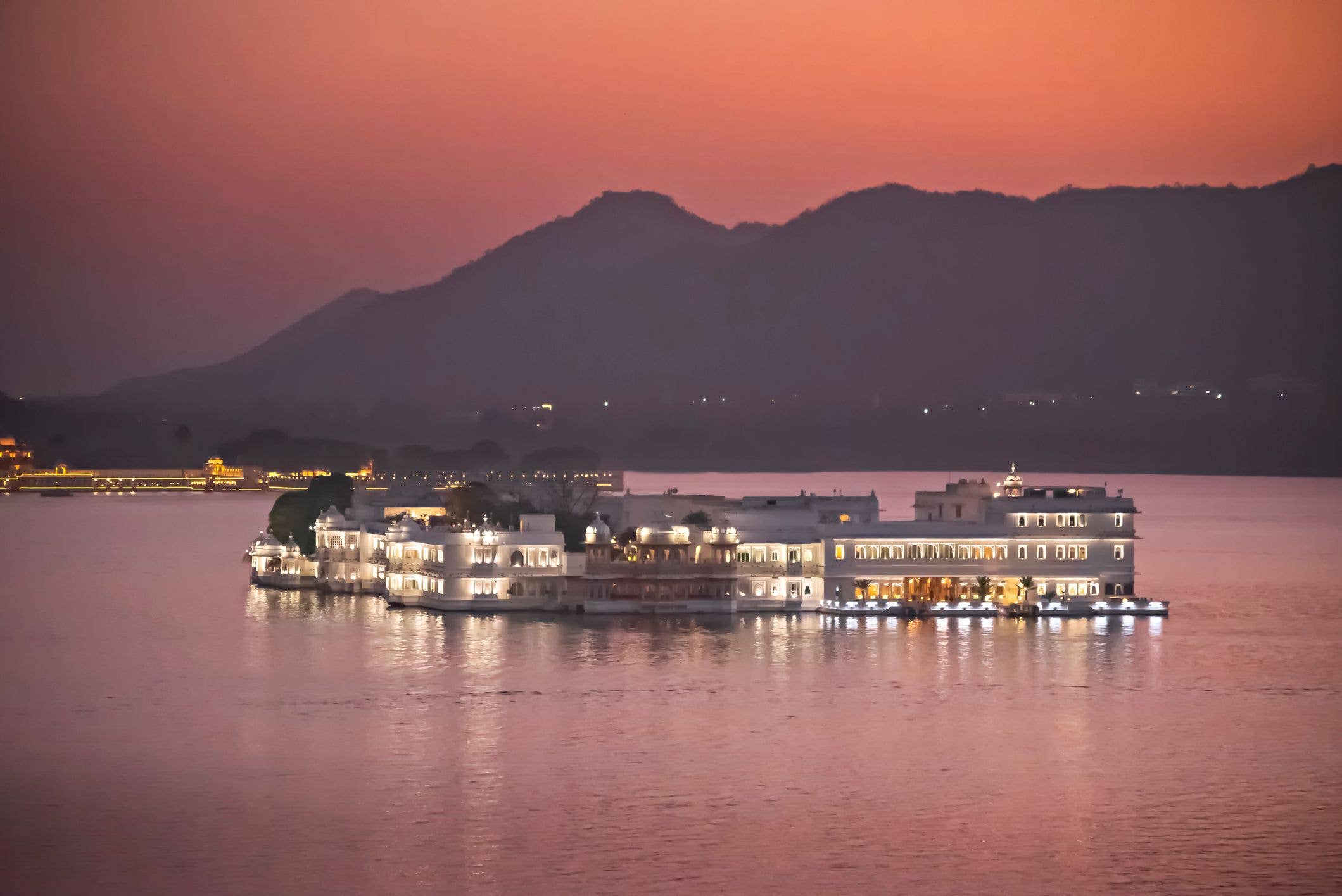 The Taj Lake Palace glimmers at twilight