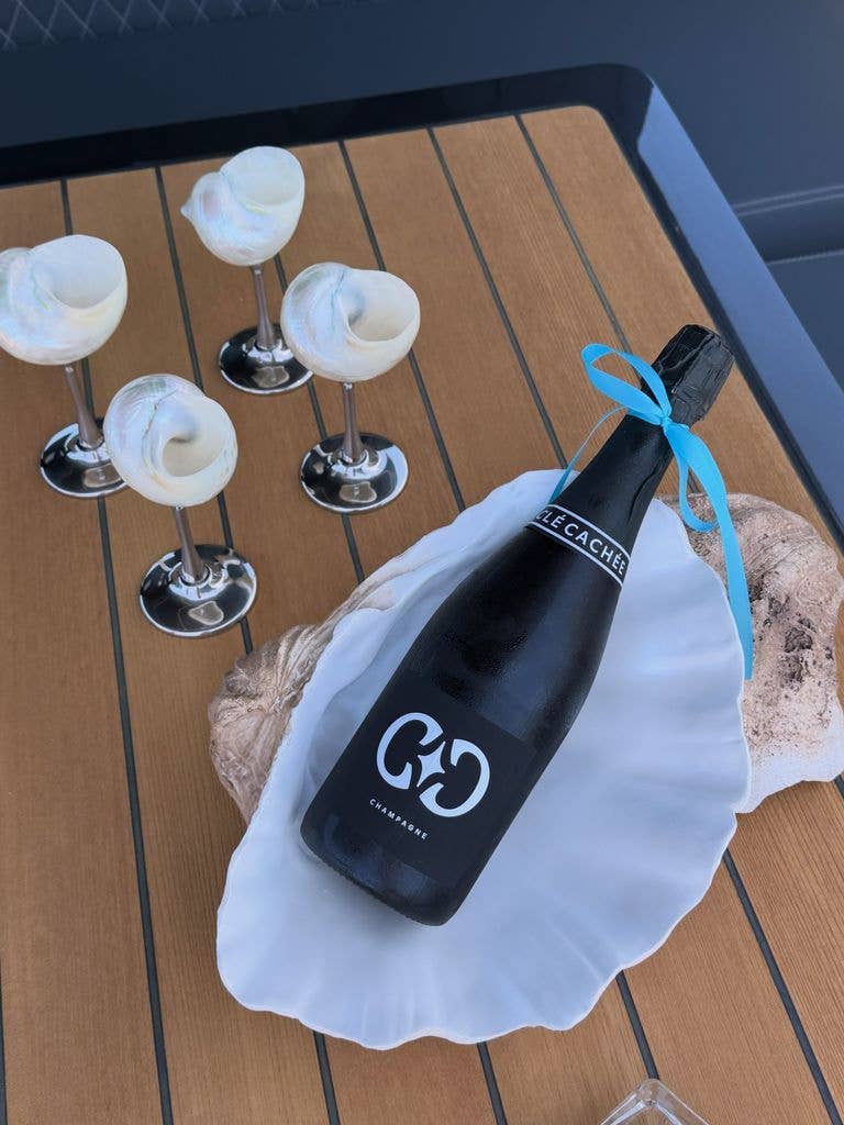 Christina and her friends sipped champagne from shell glasses