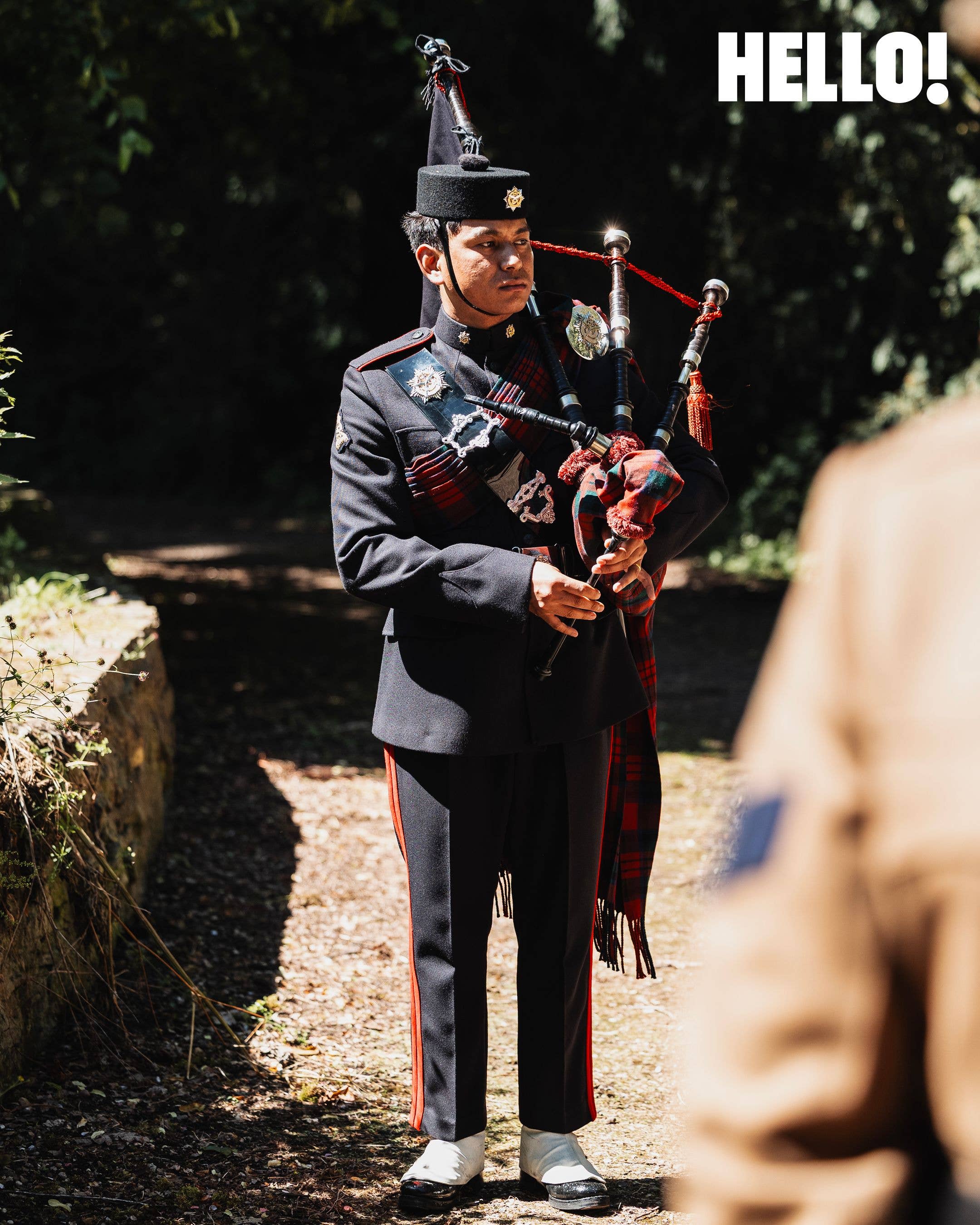 A piper played behind the couple as they walked from church to reception