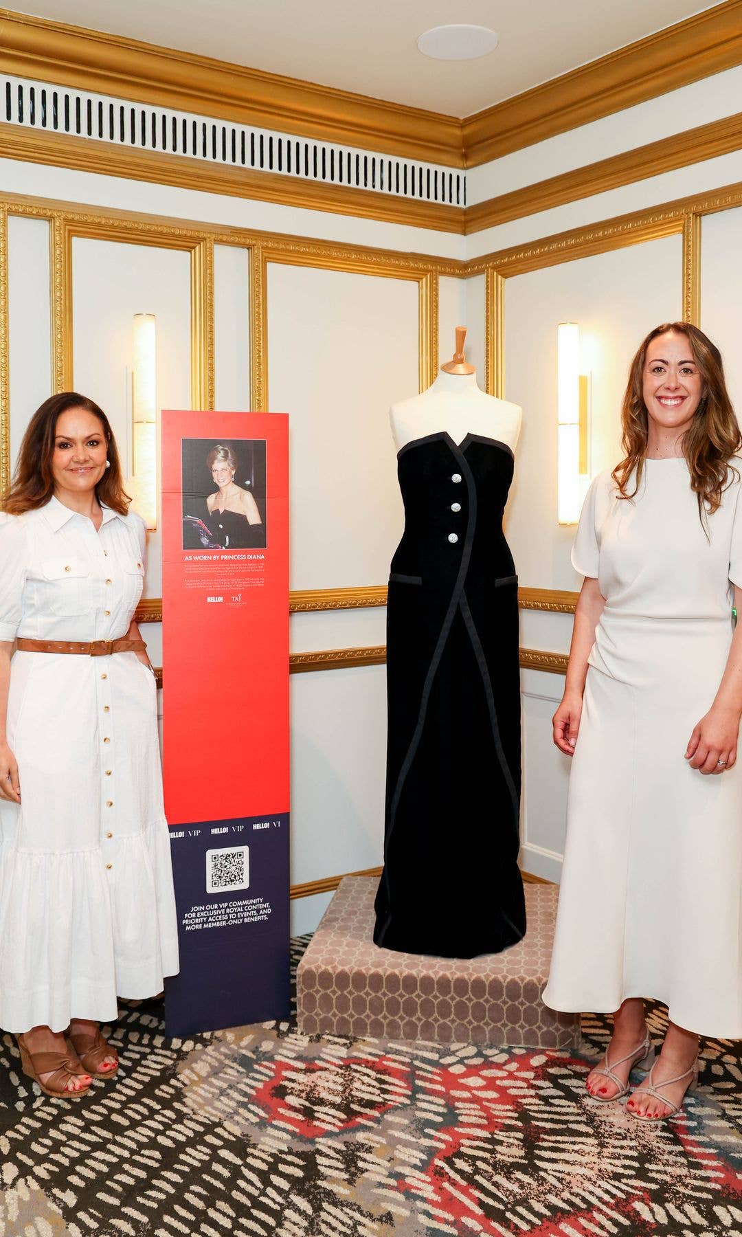 Our hosts of A Right Royal Podcast Emily Nash and Andrea Caamano pose with Princess Diana's dress at our exclusive recording
