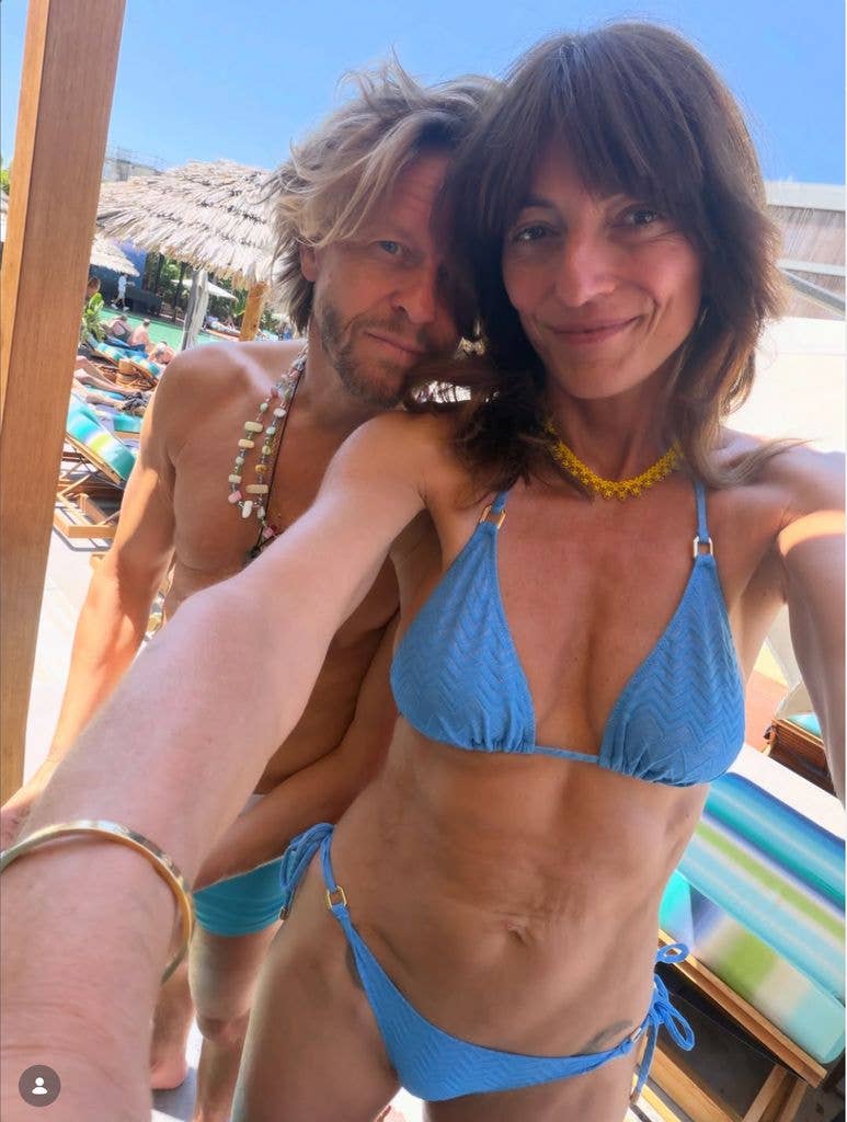 Davina McCall wearing a blue bikini