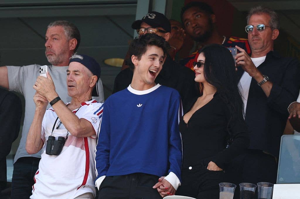 Timothee Chalamet (C), US Media personality Kylie Jenner (R), and Marc Chalamet (L) attend the 2026 World Cup football tournament final match between Spain and Argentina at the New York/New Jersey Stadium in East Rutherford on July 19, 2026