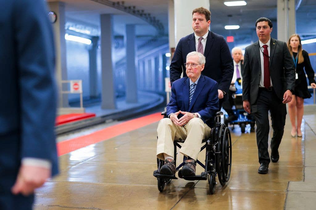 WMitch McConnel (R-KY) is pushed in a wheelchair through the Senate Subway on April 22, 2026