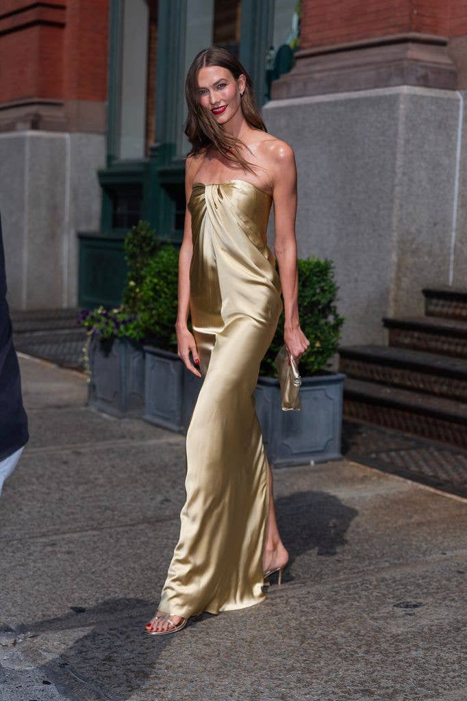 Karlie Kloss makes her way to Taylor's weddding