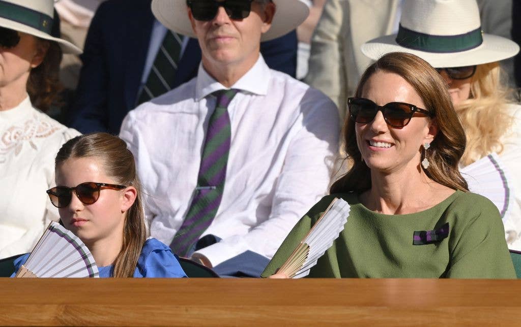 Princess Charlotte of Wales and Catherine, Princess of Wales react as they attend day fourteen of the 2026 Wimbledon Tennis Championships at the All England Lawn Tennis and Croquet Club on July 12, 2026 in London