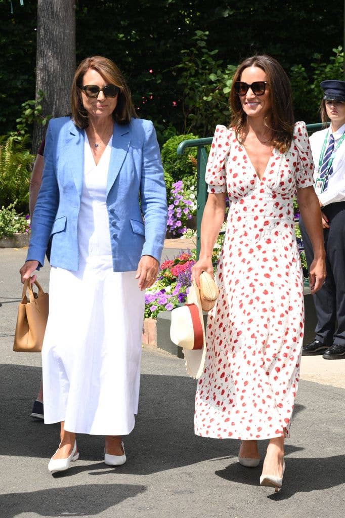 Carole wore a white dress layered with a blue linen blazer