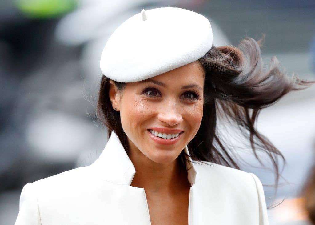Meghan Markle in white hat and coat