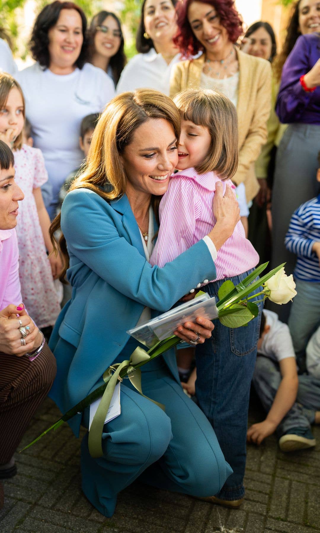 Kate has a natural rapport with children, much like Diana