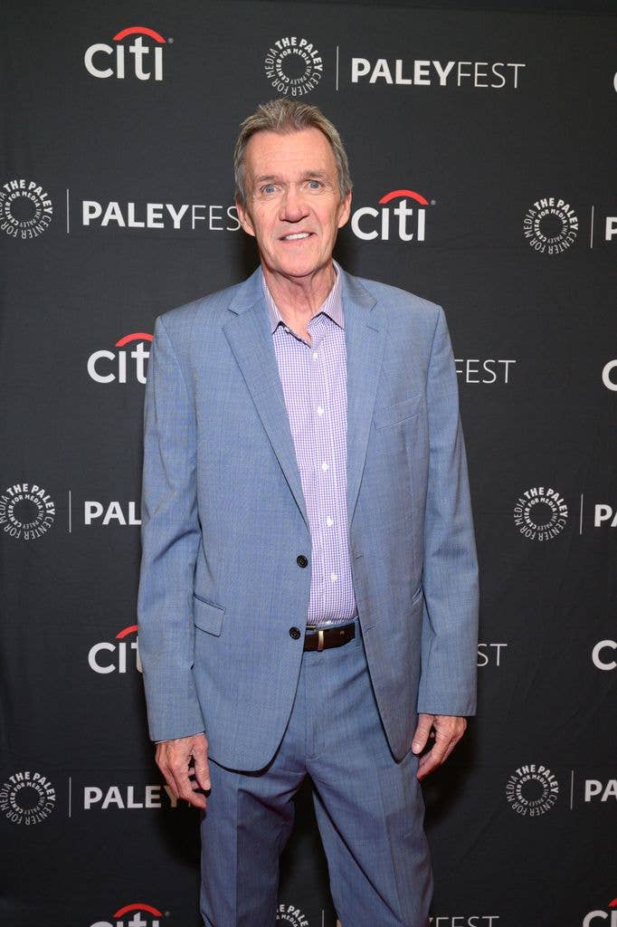Neil Flynn wearing a blue suit