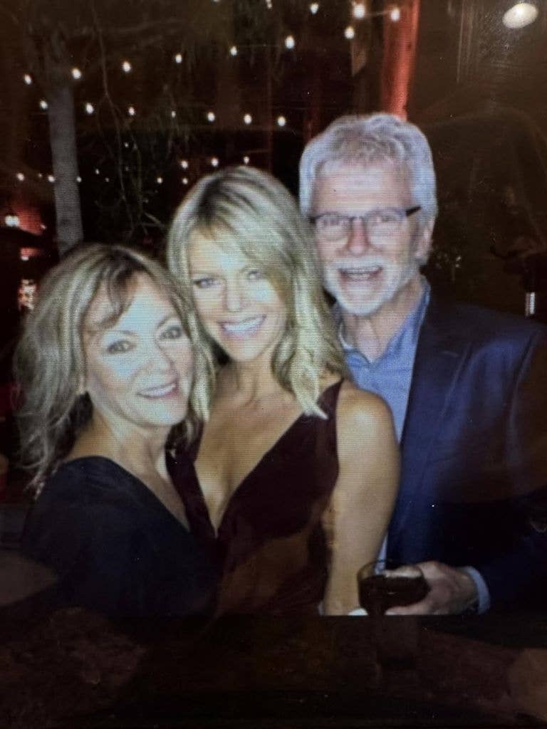Kaitlin Olson posing for a photo with her parents, shared via Instagram