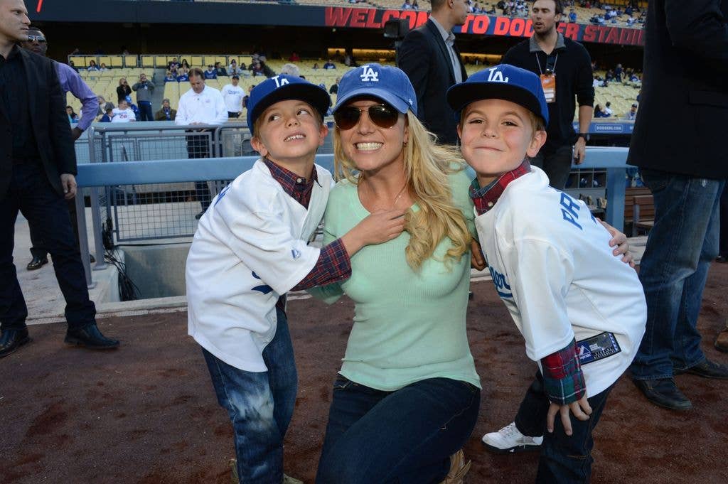 Britney Spears poses with sons Jayden James Federline (L) and Sean Preston Federline (R) during a game against the San Diego Padres at Dodger Stadium on April 17, 2013
