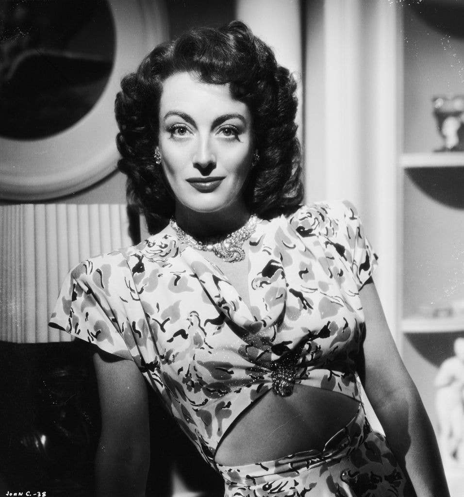 Joan Crawford wearing a patterned blouse, dated around 1944.