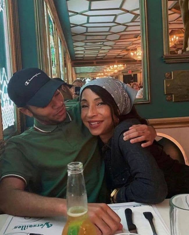Sade with her son, who has his arm wrapped around her