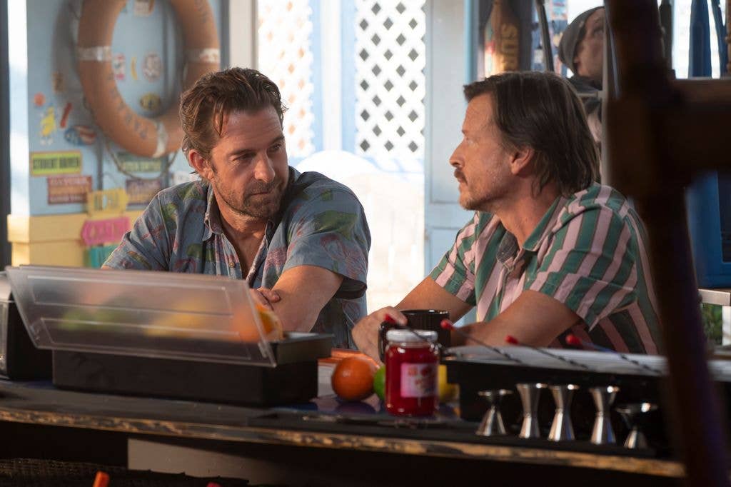 two men sitting in bar