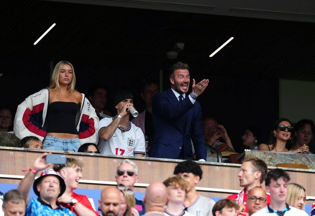 Harper in the stands with brother Romeo and dad David