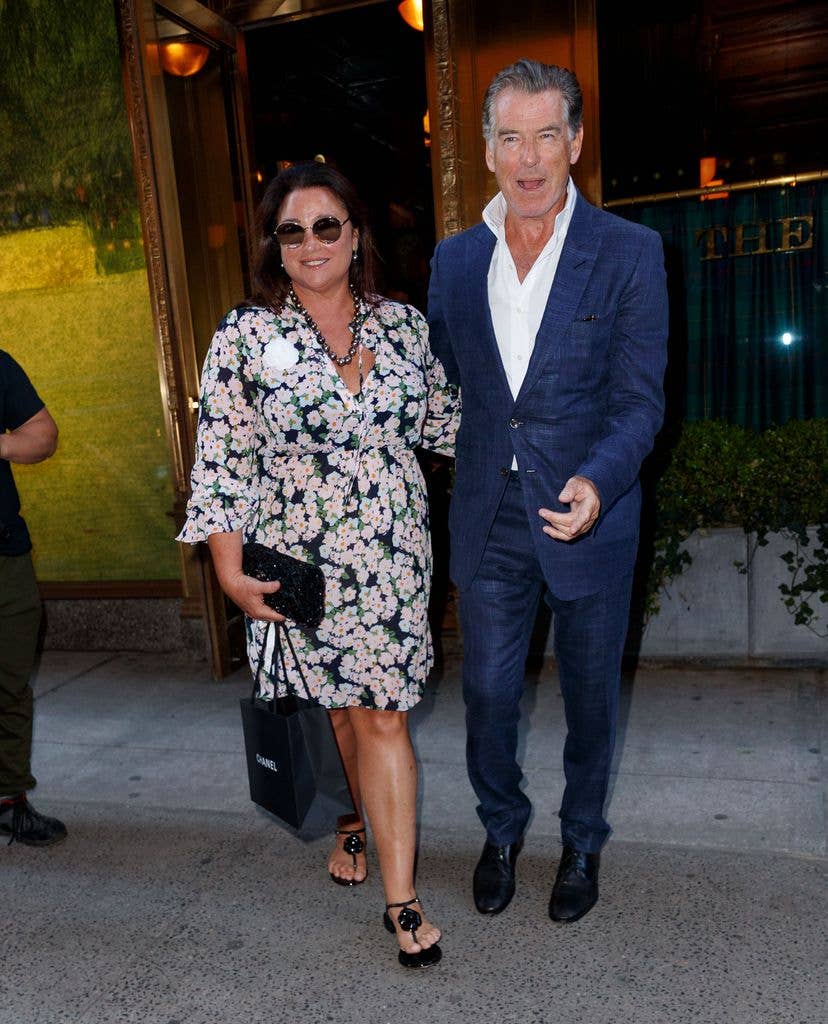 pierce brosnan and keely shaye exiting building smiling