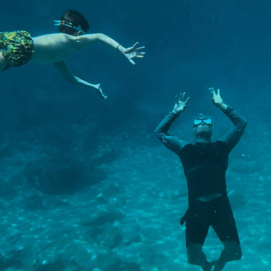 Jason enjoys a swim with son Jack