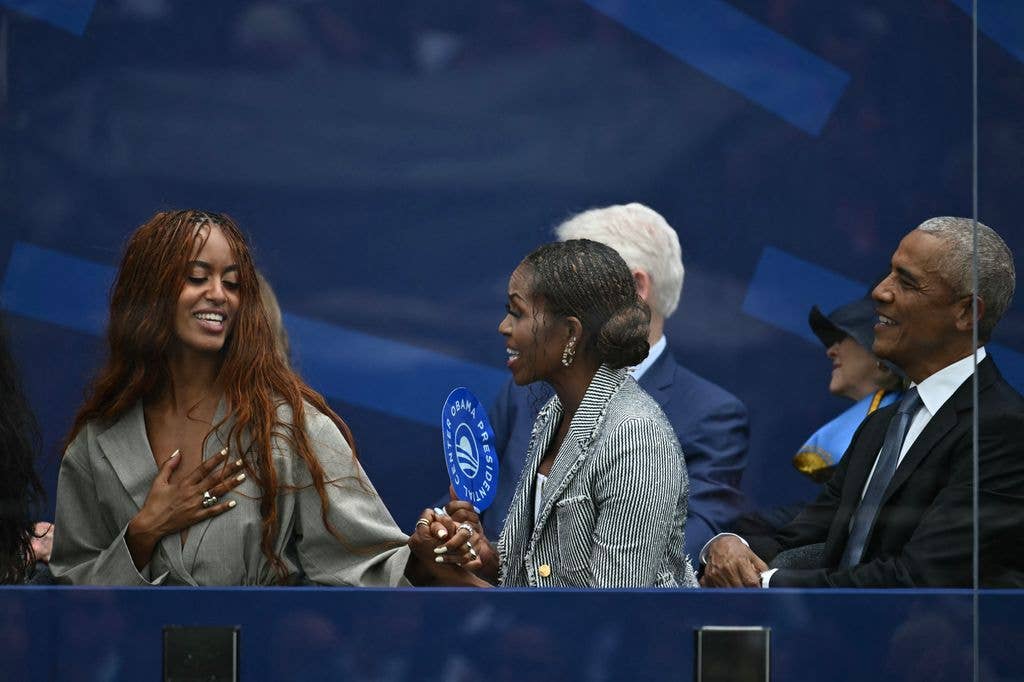 Former president Barack Obama, his wife Michelle Obama and their daughter Malia Obama attend the opening of the Barack Obama Presidential Center in Chicago, Illinois, on June 18, 2026