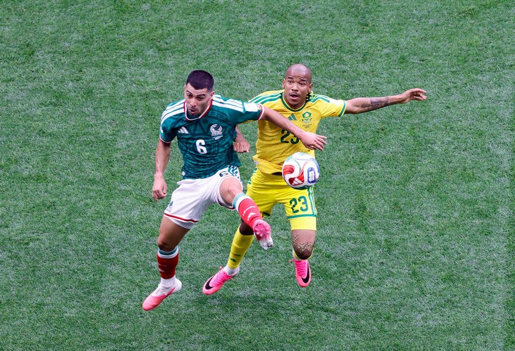 Mexico's midfielder #06 Erik Lira and South Africa's midfielder #23 Jayden Adams fight for the ball during the 2026 World Cup Group A football match 