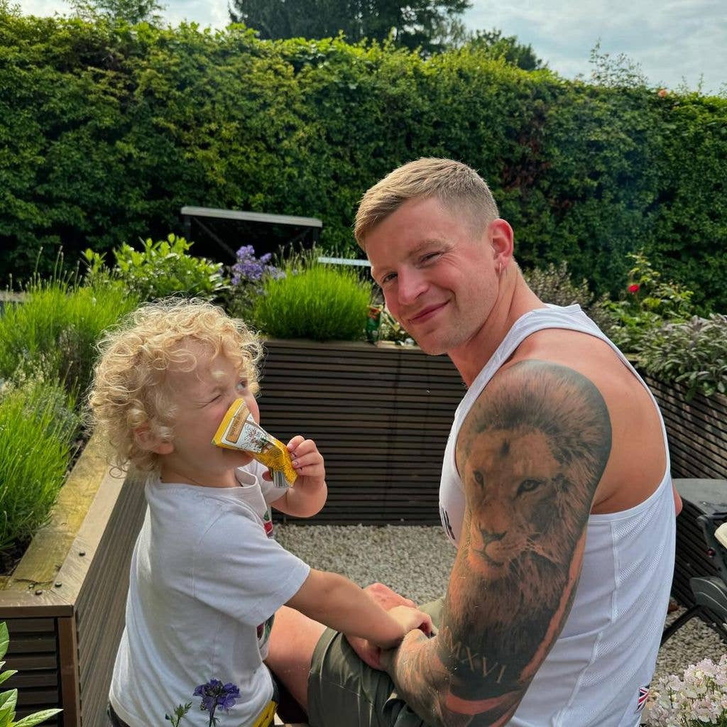 Adam Peaty with his son George