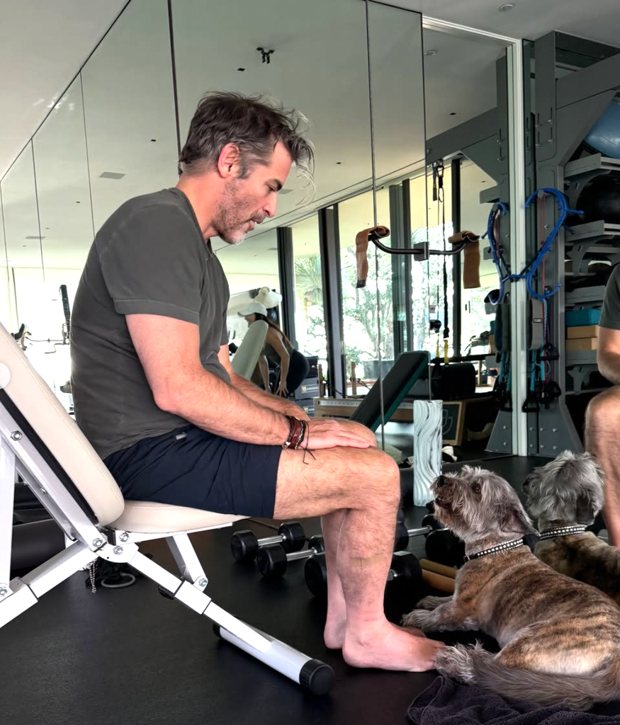 Jim with Jennifer's dog in the gym