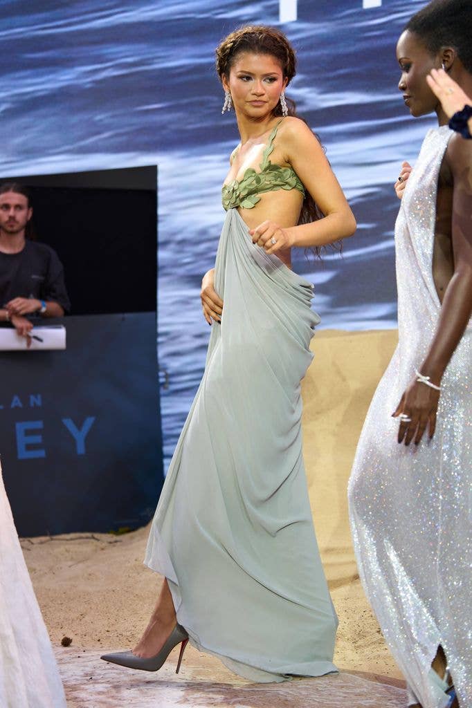 A photo of Zendaya wearing a grey and green dress