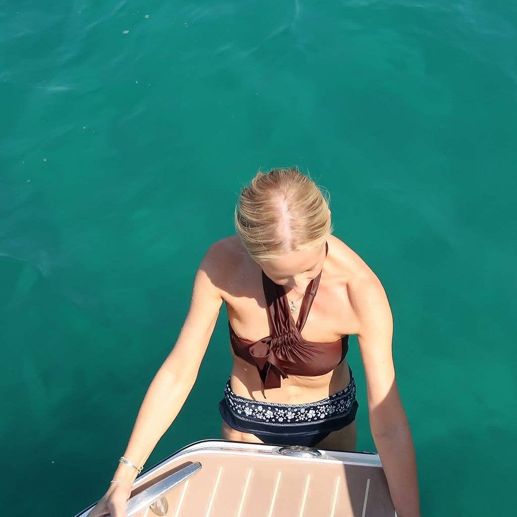 Sarah shared snapshots of herself taking refreshing dips in the Mediterranean