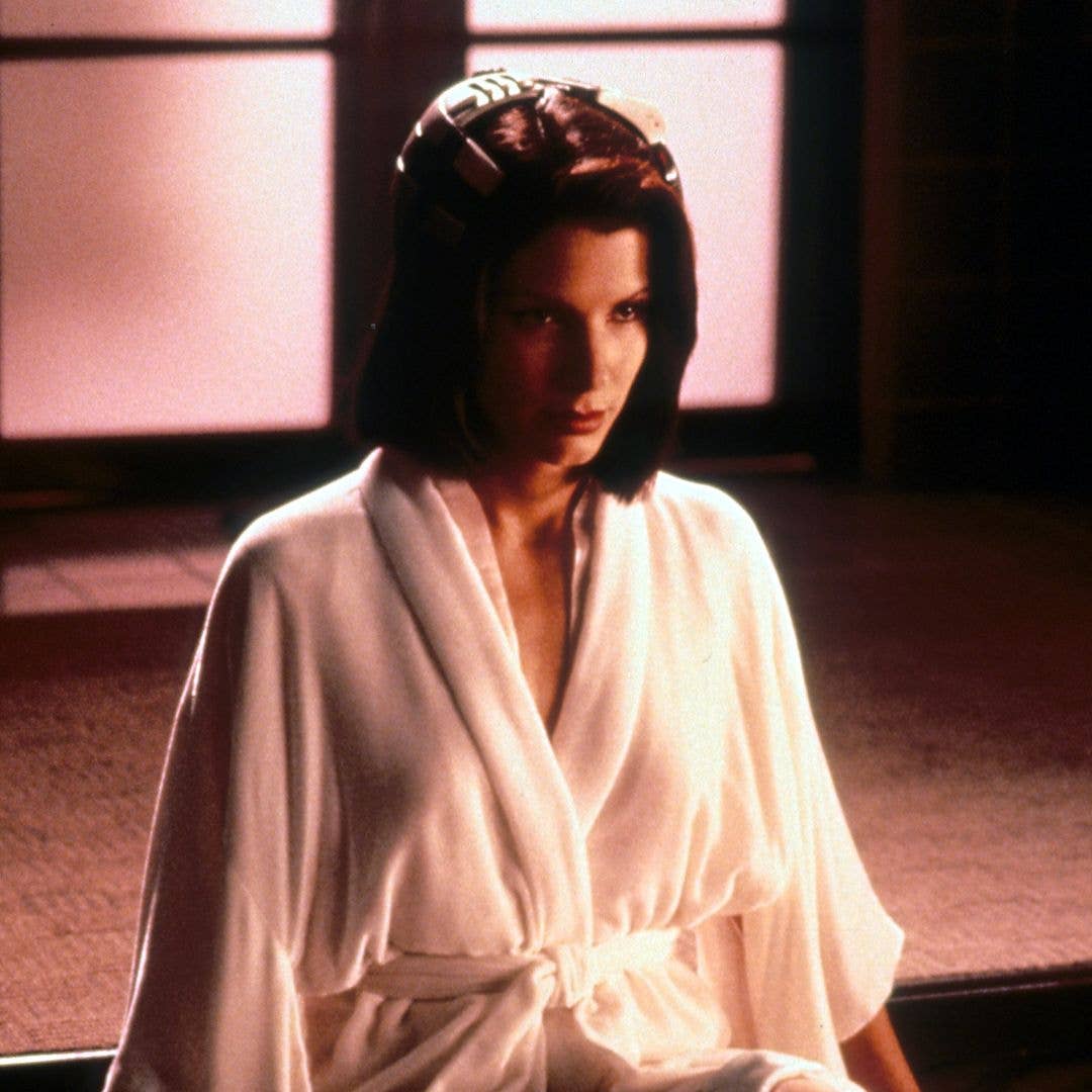 Sandra Bullock wearing a robe in a scene from the film 'Demolition Man', 1993.