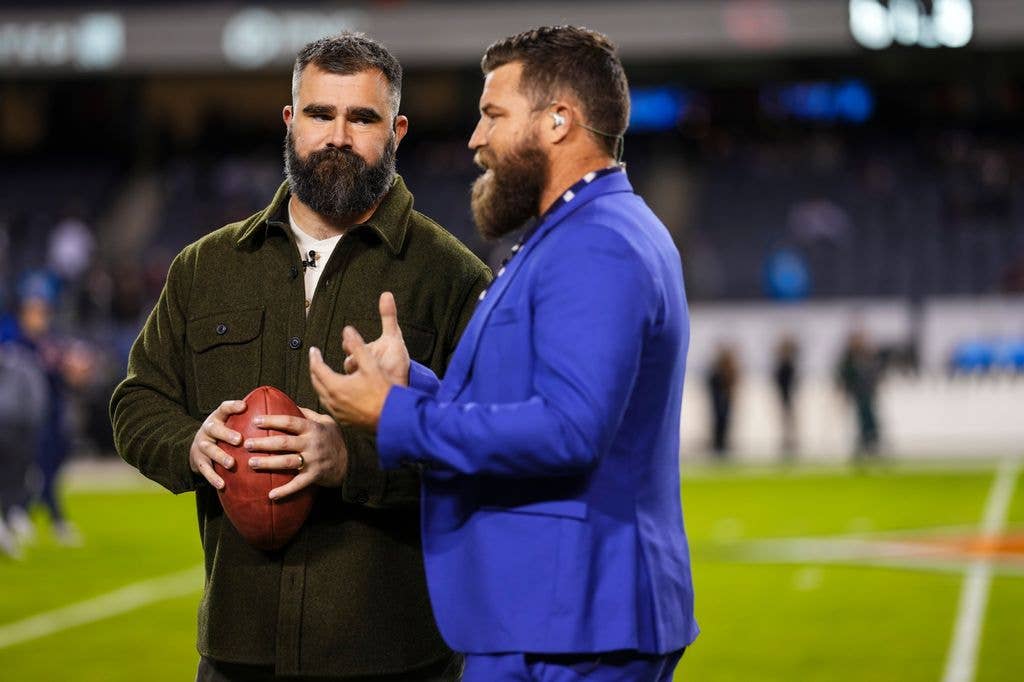Ryan Fitzpatrick talks with Jason Kelce prior to an NFL football game between the Carolina Panthers and the Chicago Bears at Soldier Field on November 9, 2023 in Chicago, Illinois. (Photo by Cooper Neill/Getty Images)