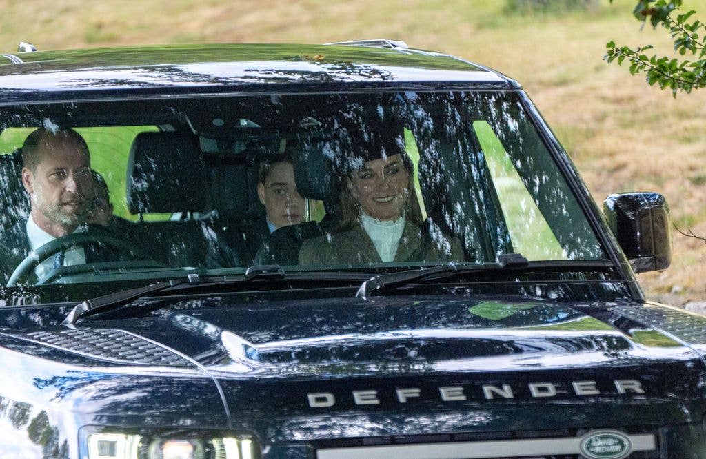 The Prince and Princess of Wales and their son Prince George and daughter Princess Charlotte (left obscured) arrive to attend a Sunday church service at Crathie Kirk, near Balmoral.