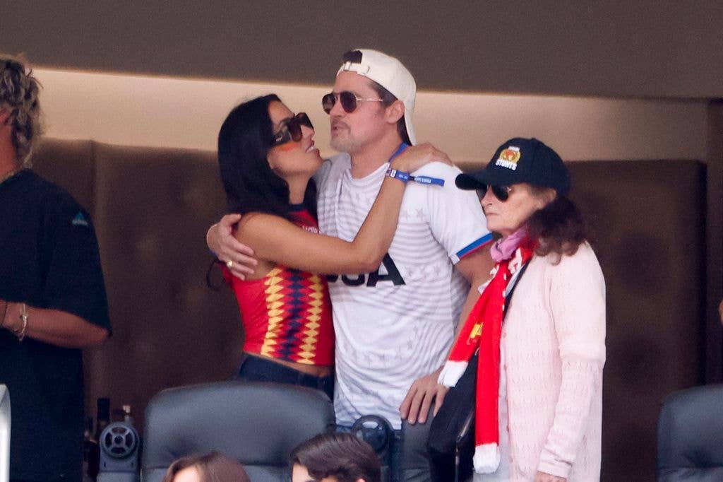 Ines de Ramon and Brad Pitt kissing during the FIFA World Cup 2026 Quarter Final football match between Spain and Belgium at Los Angeles Stadium on July 10, 2026 in Inglewood near Los Angeles, California.