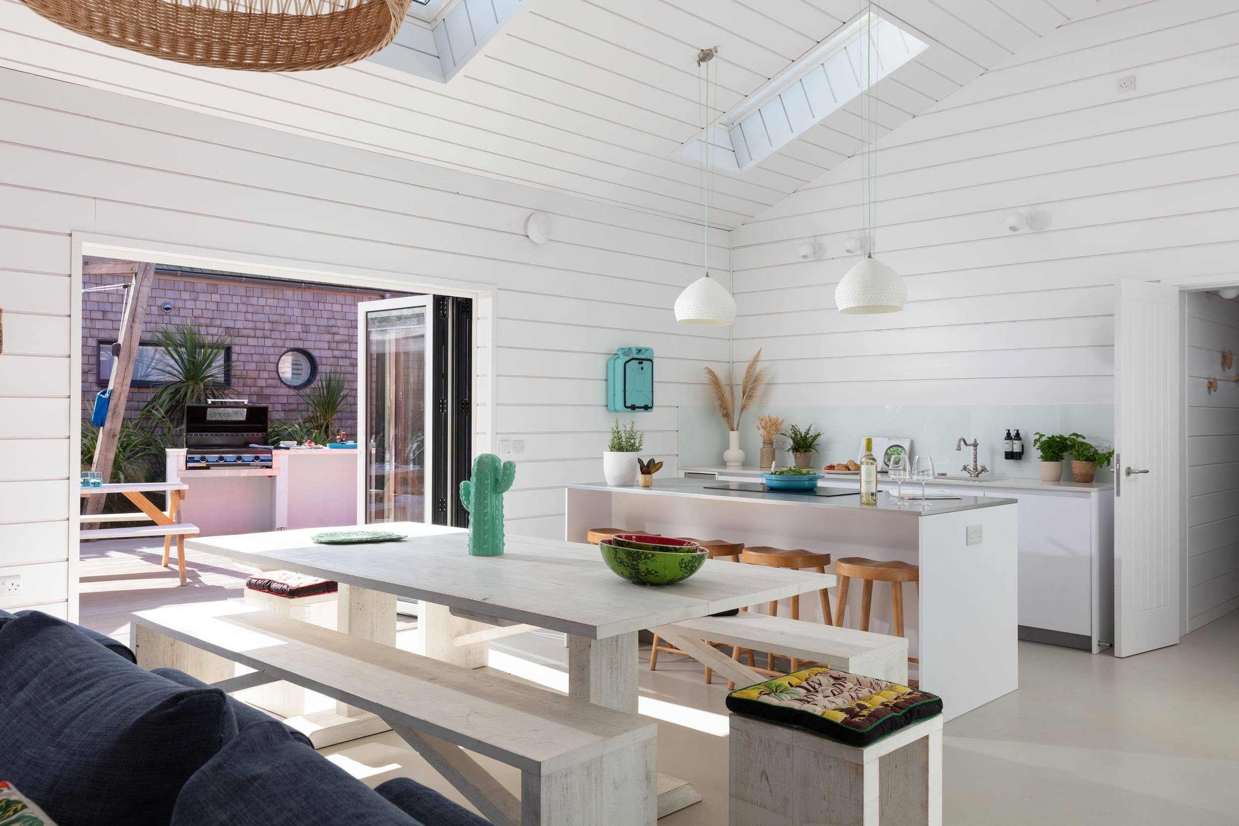 The kitchen-diner of a beach house at Three Mile Beach