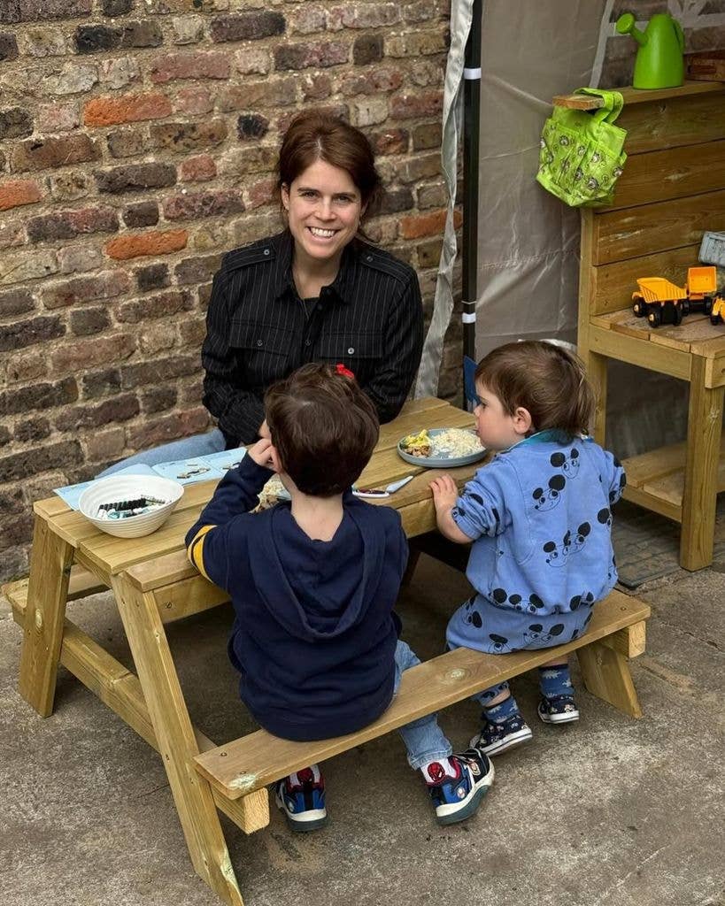 Princess Eugenie having a picnic with August and Ernest Brooksbank at a wooden table