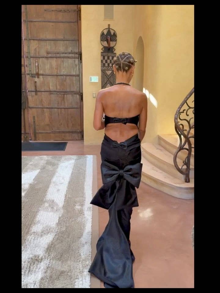 Jada Pinkett Smith walks around her Calabasas home in the black gown she wore to Jordyn Woods and Karl-Anthony Towns' wedding, posted on Instagram