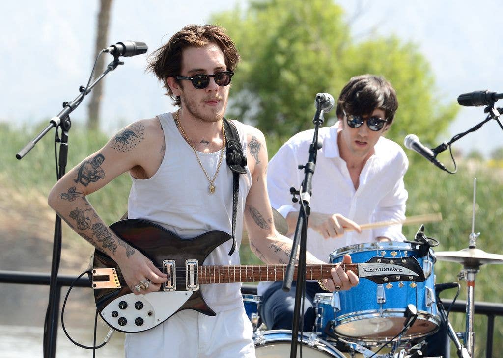Malcolm Ford (L) and The Dough Rollers perform onstage during the H&M Loves Music Coachella 2013 kick off event at Merv Griffin Estate on April 13, 2013 in La Quinta, California.