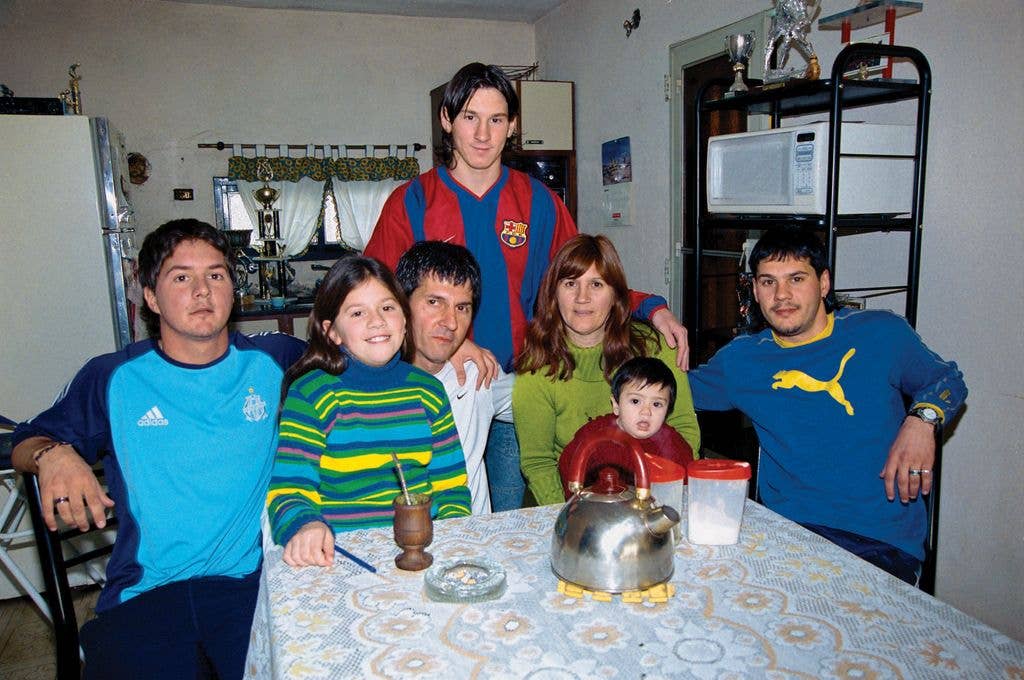 Lionel Messi poses with his brother Rodrigo (L), sister MarĂÂa Sol, father Jorge, mother Celia, nephew TomĂÂĄs and brother MatĂÂas (R) during a private photo session for El GrĂÂĄfico magazine on October 12, 2003 in Rosario, Argentina.
