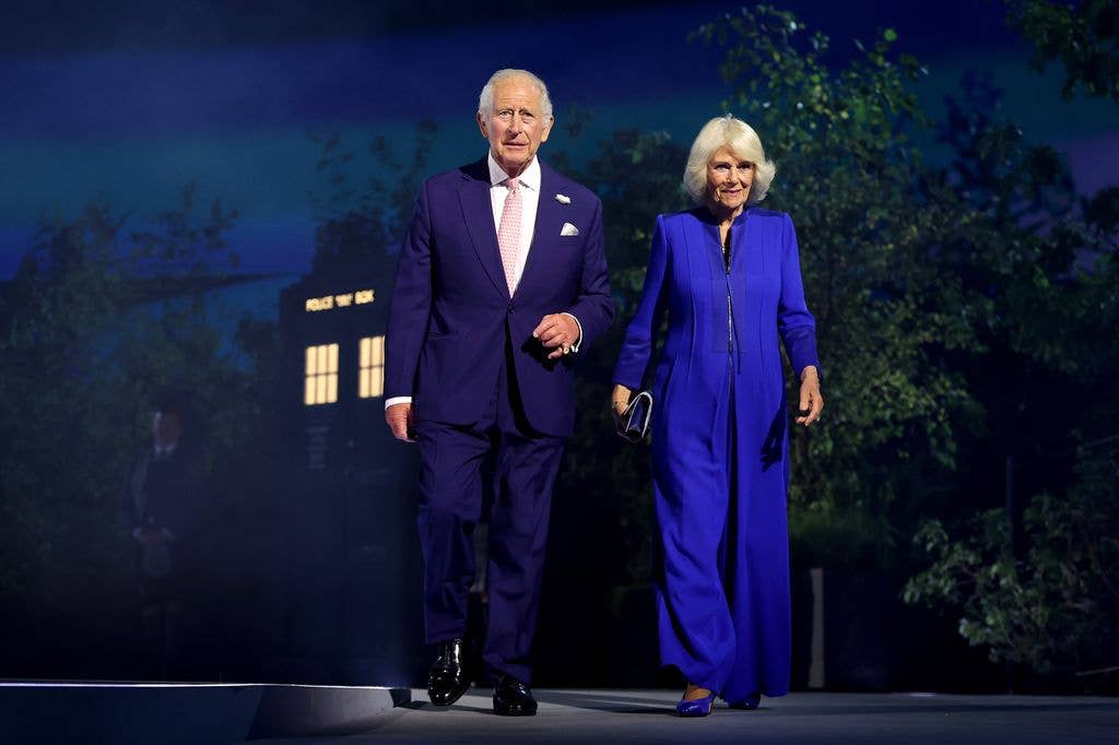  King Charles III and Queen Camilla walk on stage during the opening ceremony
