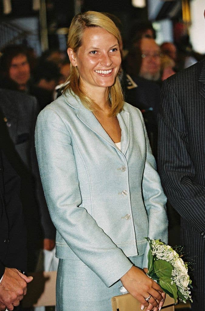 young Mette-Marit in blue skirt suit