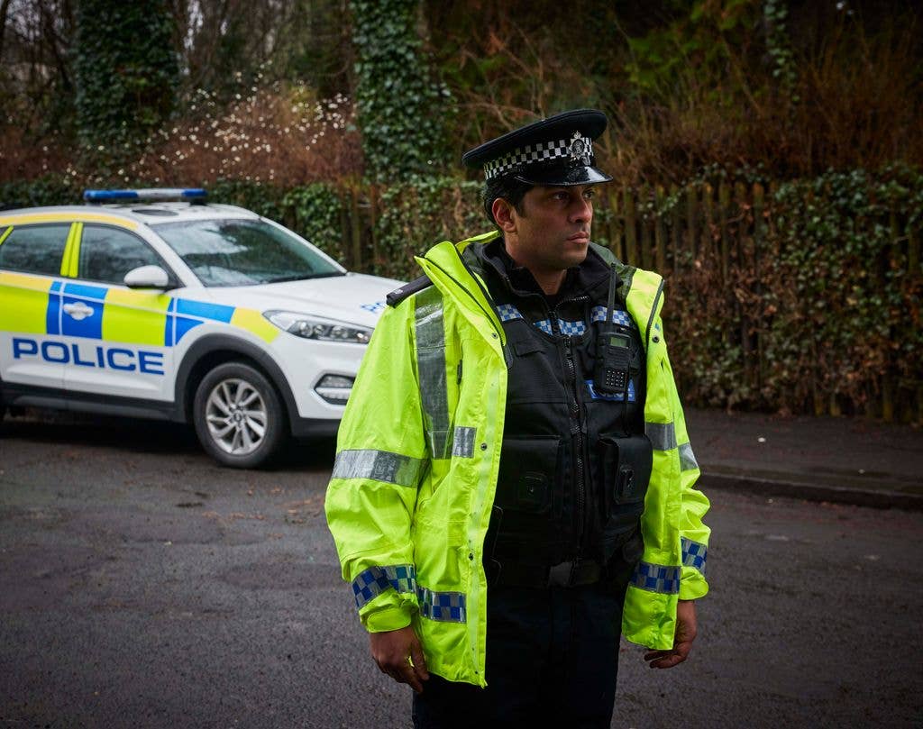 Shane Zaza plays police officer Dan