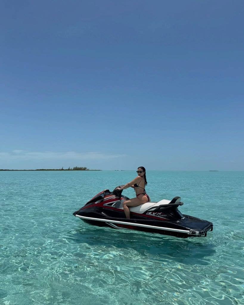 She showed off her tattoos while on a jet ski